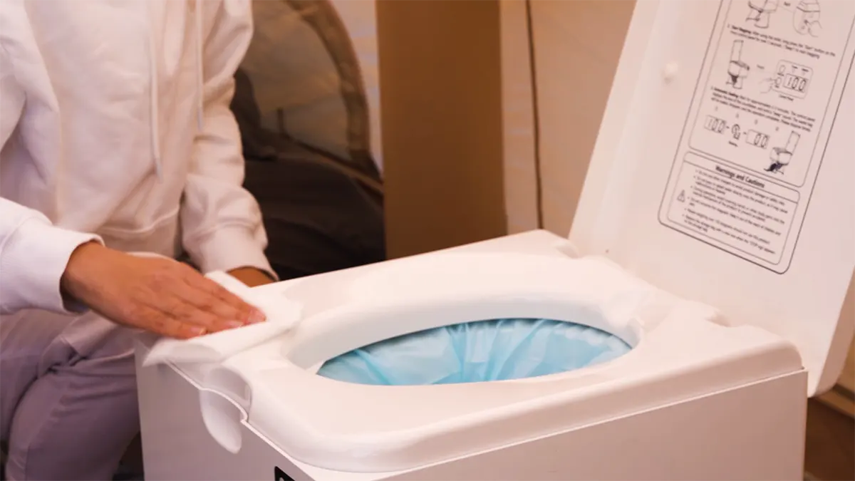 Clean and wipe the Modiwell emergency toilet
